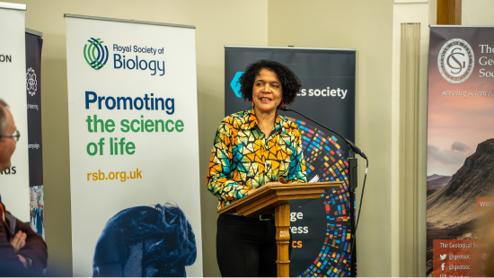 Chi Onwurah MP giving speech in front of RSB banner